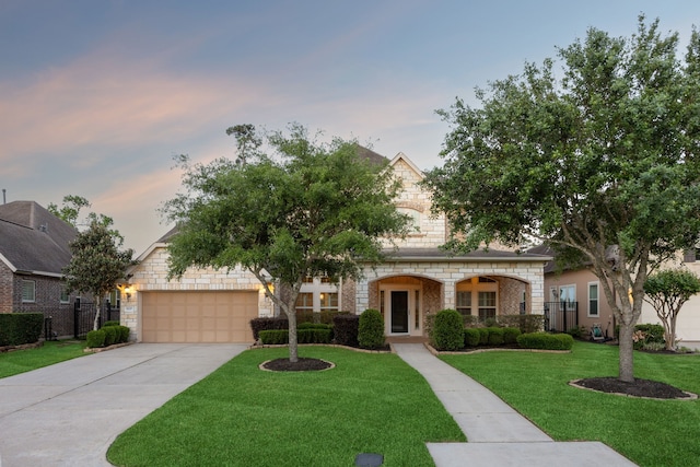 8227 Caroline Ridge Dr, Humble, TX 77396 - view of front facade with stone siding, an attached garage, and driveway