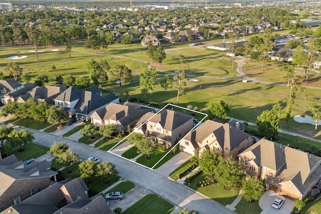 8227 Caroline Ridge Dr, Humble, TX 77396 - aerial view of property's location with nearby suburban area, a golf course, and property parcel outlined