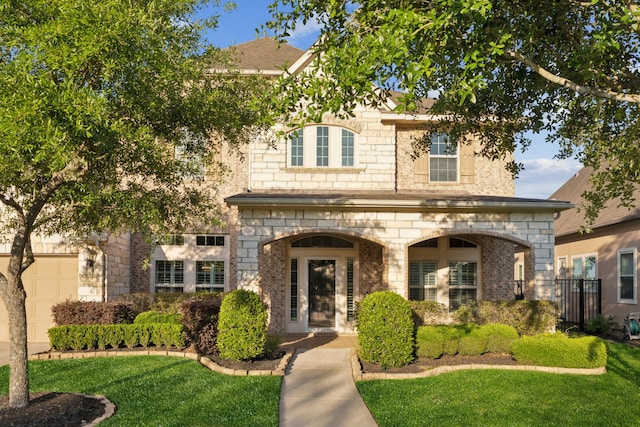 8227 Caroline Ridge Dr, Humble, TX 77396 - view of front of property featuring stone siding and a front lawn