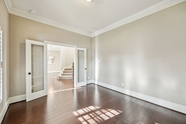 8227 Caroline Ridge Dr, Humble, TX 77396 - unfurnished room featuring french doors, dark wood-style floors, crown molding, stairs, and baseboards