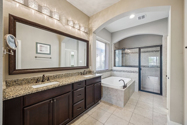 8227 Caroline Ridge Dr, Humble, TX 77396 - bathroom with a garden tub, a stall shower, tile patterned floors, and double vanity