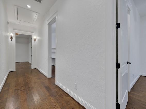 1408 W 23rd St, Houston, TX 77008 - corridor featuring baseboards, attic access, and wood finished floors
