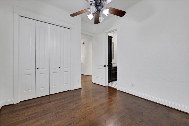 1408 W 23rd St, Houston, TX 77008 - unfurnished bedroom with a closet, dark wood-style flooring, baseboards, and a ceiling fan