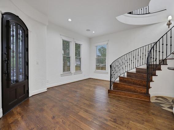 1408 W 23rd St, Houston, TX 77008 - foyer with recessed lighting, stairway, baseboards, and wood finished floors