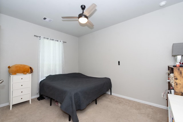bedroom with light carpet, baseboards, and ceiling fan