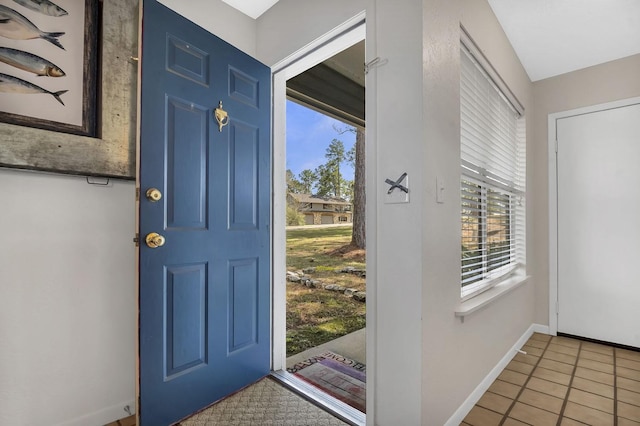 212 Woodcrest Dr, Brookeland, TX 75931 - doorway featuring tile patterned floors and baseboards
