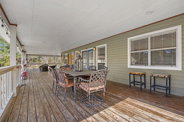 212 Woodcrest Dr, Brookeland, TX 75931 - wooden deck with outdoor dining space
