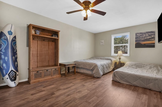 212 Woodcrest Dr, Brookeland, TX 75931 - bedroom with wood finished floors and ceiling fan