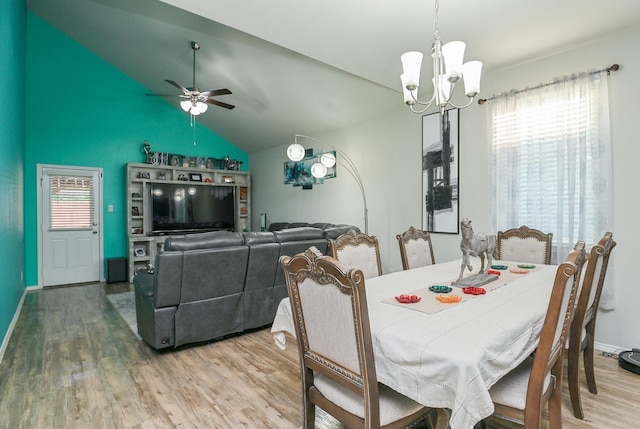 21003 Iris Holly St, Katy, TX 77449 - dining room featuring plenty of natural light, lofted ceiling, and wood finished floors