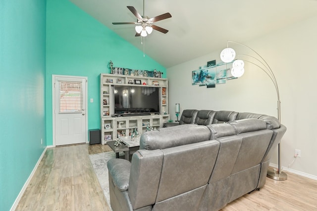 21003 Iris Holly St, Katy, TX 77449 - living area featuring ceiling fan, vaulted ceiling, wood finished floors, and baseboards