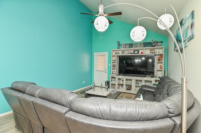 21003 Iris Holly St, Katy, TX 77449 - living room with wood finished floors, ceiling fan, baseboards, and high vaulted ceiling