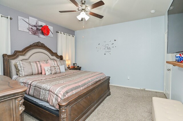 21003 Iris Holly St, Katy, TX 77449 - bedroom featuring light carpet, baseboards, and a ceiling fan