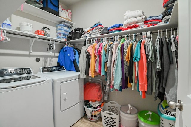 21003 Iris Holly St, Katy, TX 77449 - washroom with laundry area, wood finished floors, and washing machine and clothes dryer