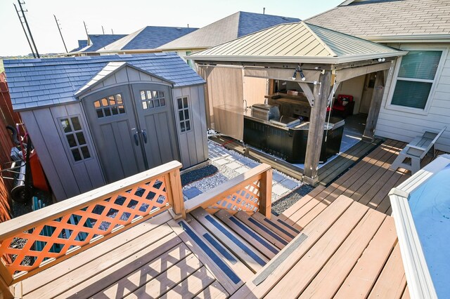21003 Iris Holly St, Katy, TX 77449 - wooden deck featuring a storage shed and an outdoor structure
