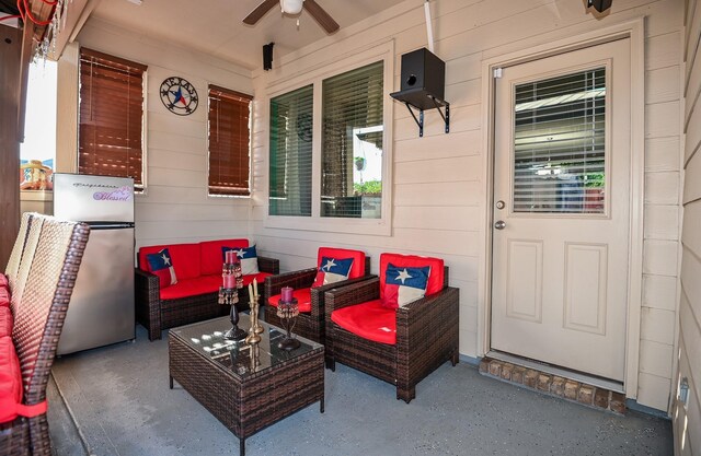 21003 Iris Holly St, Katy, TX 77449 - exterior space featuring covered porch, a ceiling fan, and an outdoor hangout area