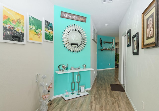 21003 Iris Holly St, Katy, TX 77449 - hall featuring visible vents, baseboards, and wood finished floors