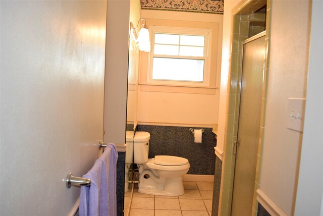 full bath featuring an enclosed shower, tile patterned floors, and toilet