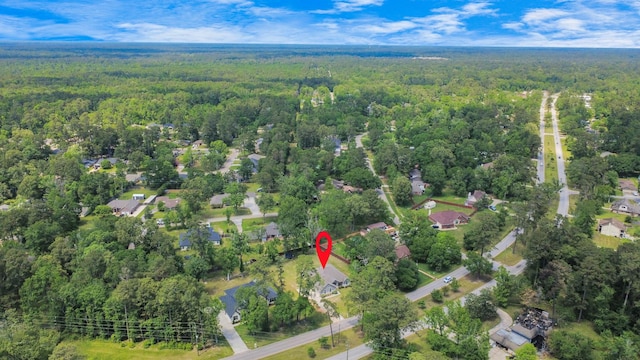 aerial view featuring a view of trees