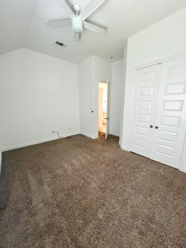 1610 Nacogdoches Valley Dr, League City, TX 77573 - unfurnished bedroom with a closet, vaulted ceiling, visible vents, carpet floors, and baseboards