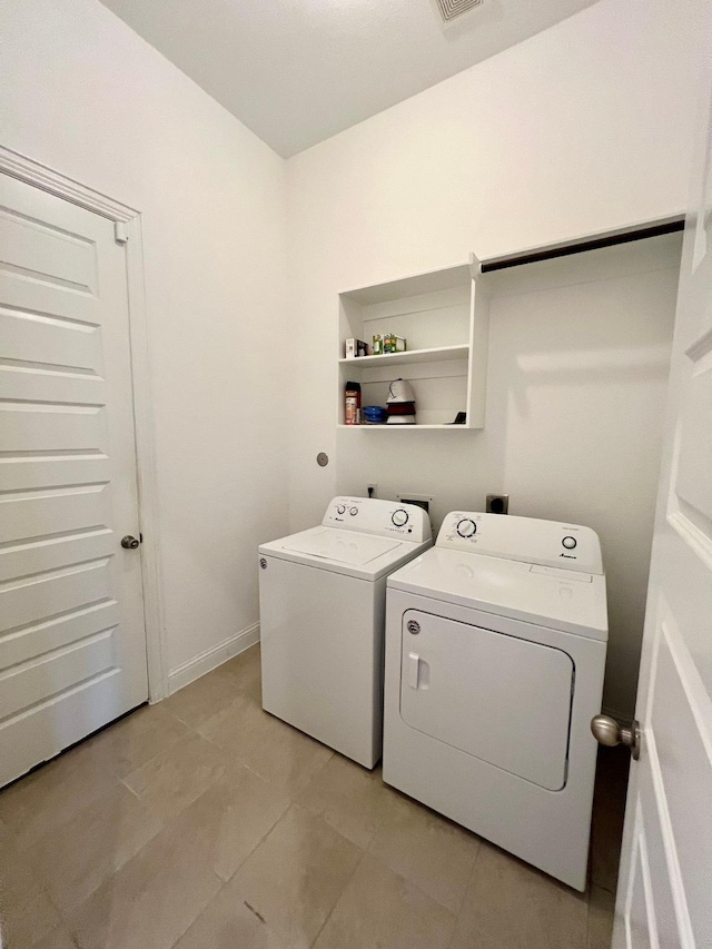 1610 Nacogdoches Valley Dr, League City, TX 77573 - clothes washing area with light tile patterned floors, separate washer and dryer, laundry area, and visible vents
