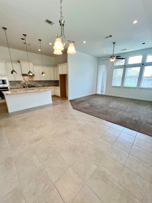 1610 Nacogdoches Valley Dr, League City, TX 77573 - kitchen with stainless steel microwave, recessed lighting, light tile patterned flooring, and wall oven