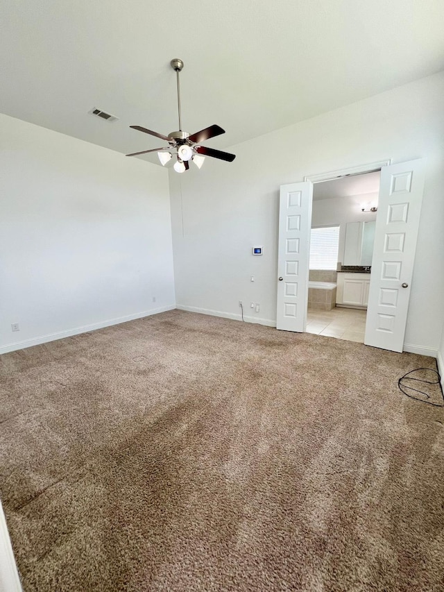 1610 Nacogdoches Valley Dr, League City, TX 77573 - empty room with light carpet, ceiling fan, baseboards, and visible vents