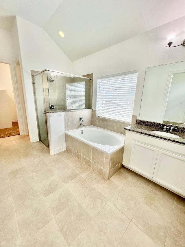 1610 Nacogdoches Valley Dr, League City, TX 77573 - bathroom with a shower stall, vanity, vaulted ceiling, tile patterned flooring, and a garden tub