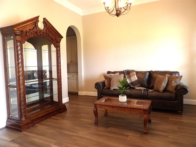 89 Grandview Blvd, Montgomery, TX 77356 - living room with arched walkways, crown molding, baseboards, wood finished floors, and a chandelier