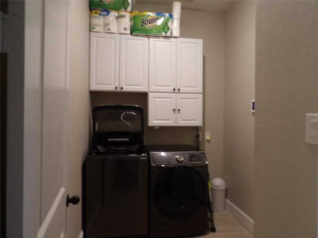 89 Grandview Blvd, Montgomery, TX 77356 - laundry room with cabinet space, washer and dryer, and baseboards