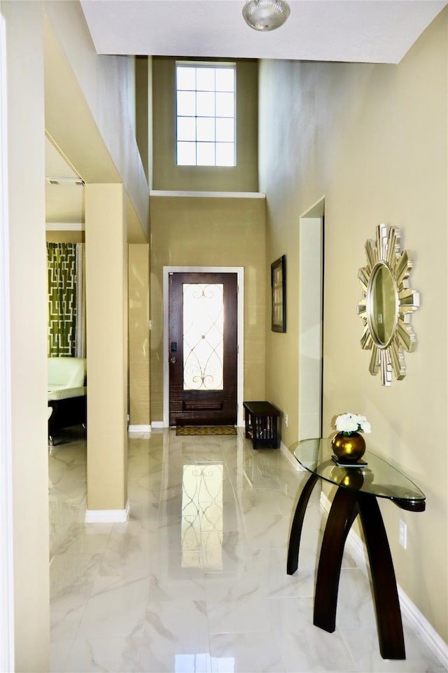 9307 Langley Springs Dr, Houston, TX 77095 - foyer entrance featuring marble tiled flooring, baseboards, and a towering ceiling