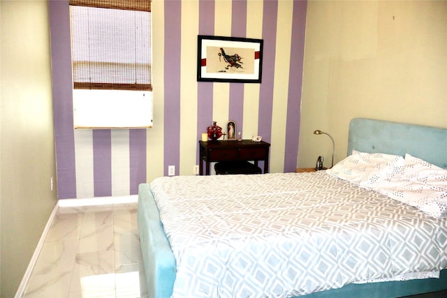 9307 Langley Springs Dr, Houston, TX 77095 - bedroom with baseboards, marble look tiles, and wallpapered walls