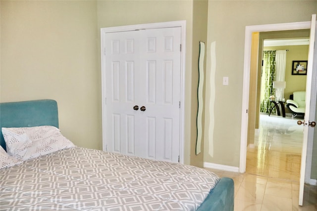 9307 Langley Springs Dr, Houston, TX 77095 - bedroom featuring a closet and baseboards