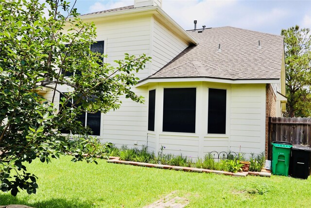 9307 Langley Springs Dr, Houston, TX 77095 - rear view of property featuring roof with shingles and a chimney