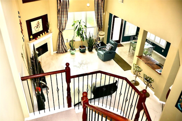 9307 Langley Springs Dr, Houston, TX 77095 - staircase with a fireplace and baseboards