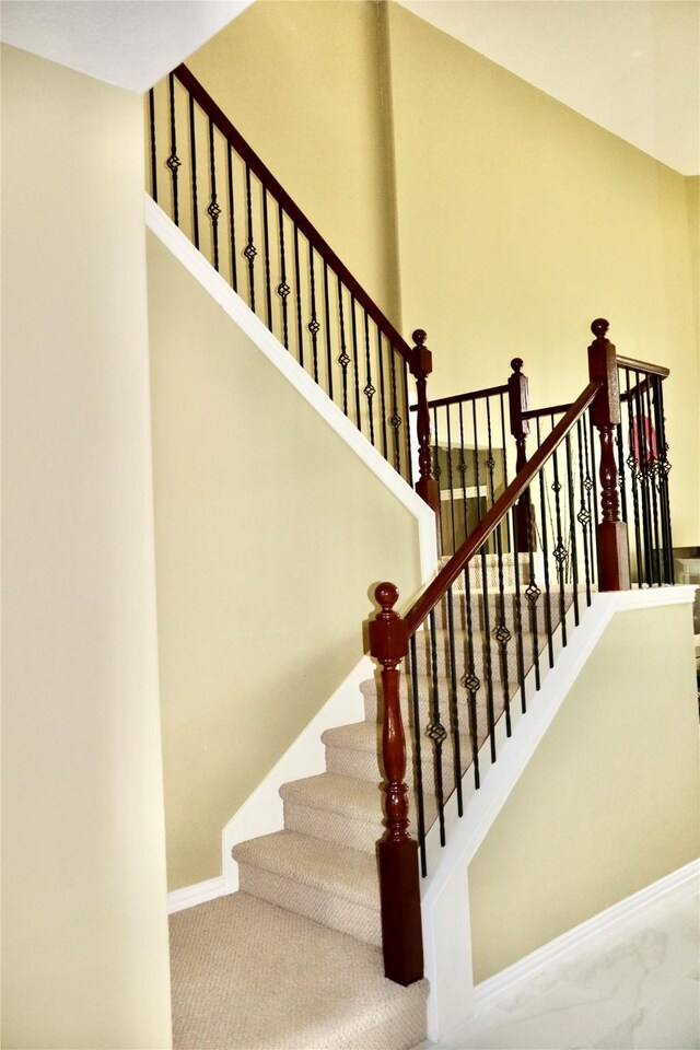 9307 Langley Springs Dr, Houston, TX 77095 - stairway with baseboards