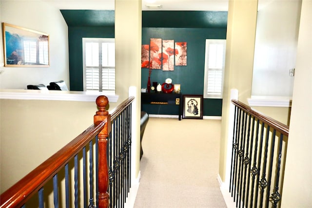 9307 Langley Springs Dr, Houston, TX 77095 - hall with an upstairs landing, carpet flooring, and baseboards