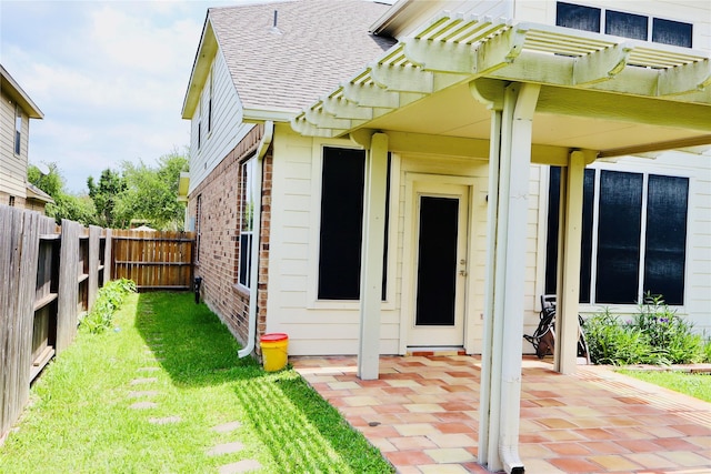 9307 Langley Springs Dr, Houston, TX 77095 - property entrance featuring a shingled roof, brick siding, a patio area, and a pergola
