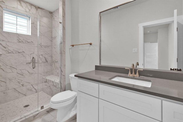 full bath featuring vanity, toilet, a shower stall, and marble finish floor