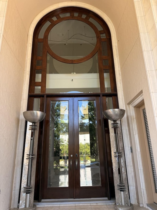 view of exterior entry featuring french doors