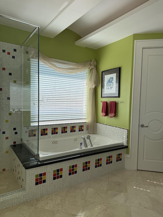 bathroom with tile patterned floors, a bath, and a shower stall