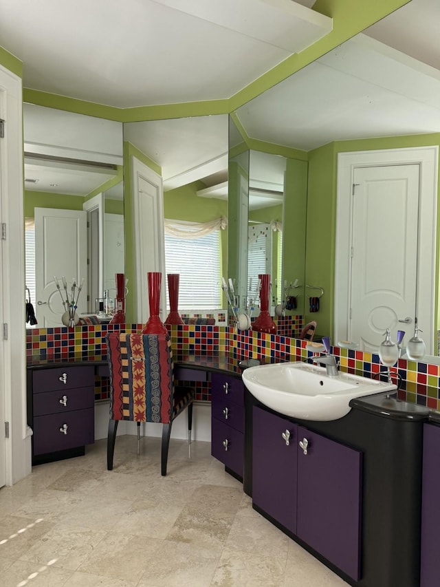 bathroom featuring backsplash and vanity