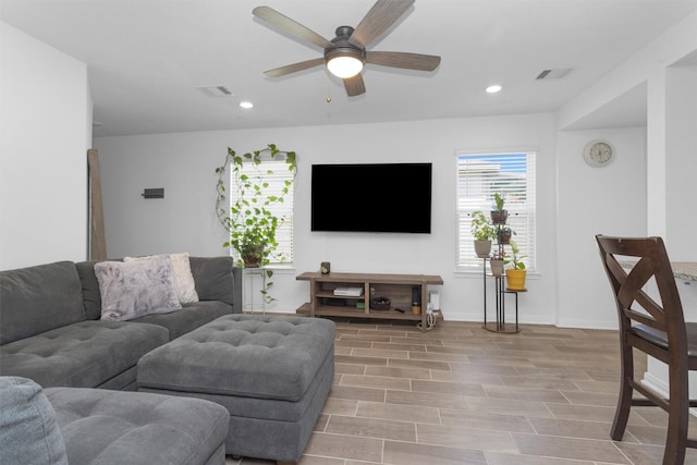 living room with baseboards, recessed lighting, visible vents, ceiling fan, and wood finished floors
