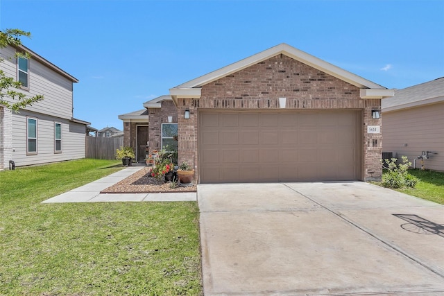 single story home featuring fence, a front lawn, brick siding, a garage, and concrete driveway
