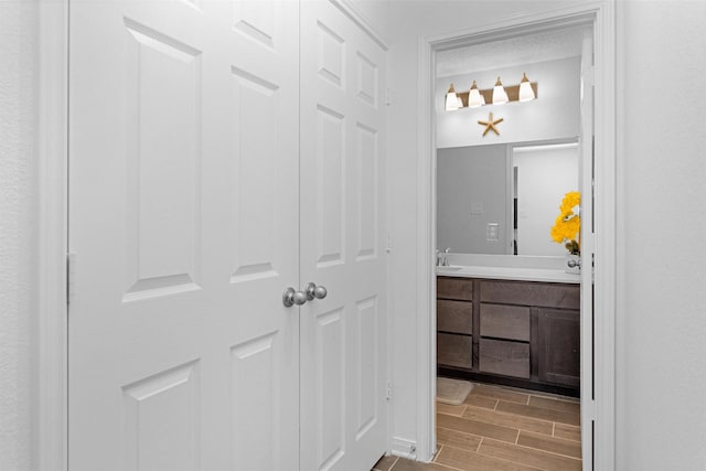 bathroom featuring vanity and wood tiled floor