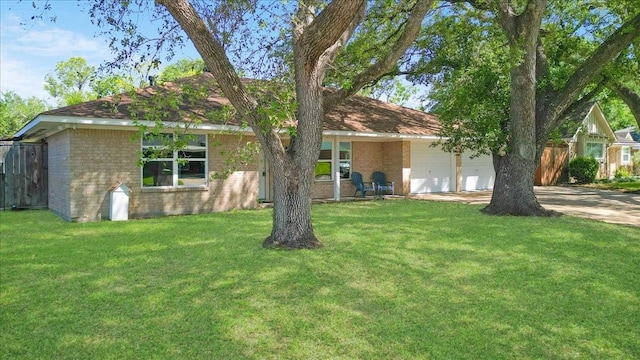 1004 Country Club Dr, Richmond, TX 77469 - view of front facade with brick siding, an attached garage, a front yard, and concrete driveway