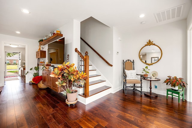 stairs featuring recessed lighting, visible vents, baseboards, and wood finished floors