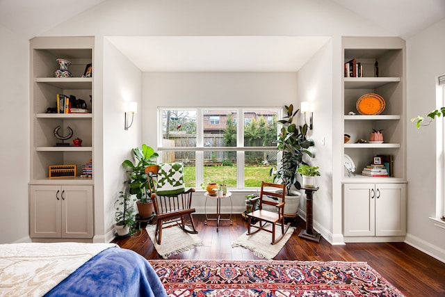 bedroom with dark wood-type flooring, baseboards, and lofted ceiling