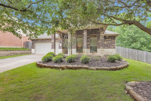 1900 Pagemill Ln, Conroe, TX 77304 - view of front facade with brick siding, concrete driveway, a garage, and stone siding