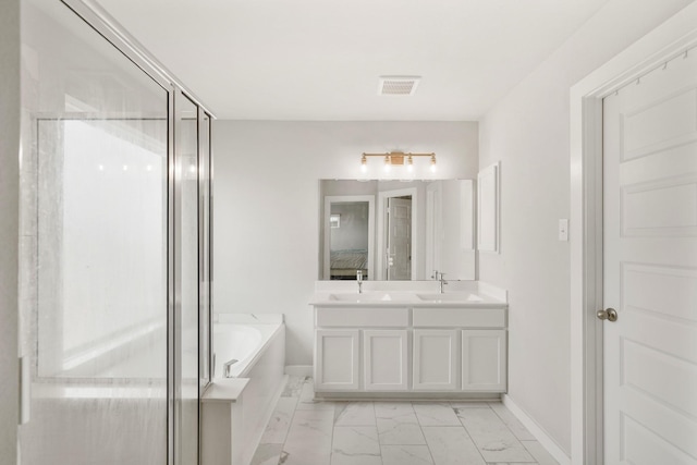 21406 Tropisea Dr, Cypress, TX 77433 - full bath with a sink, a bath, double vanity, and marble finish floor