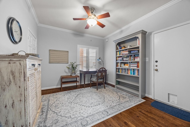sitting room with baseboards, wood finished floors, ceiling fan, and ornamental molding